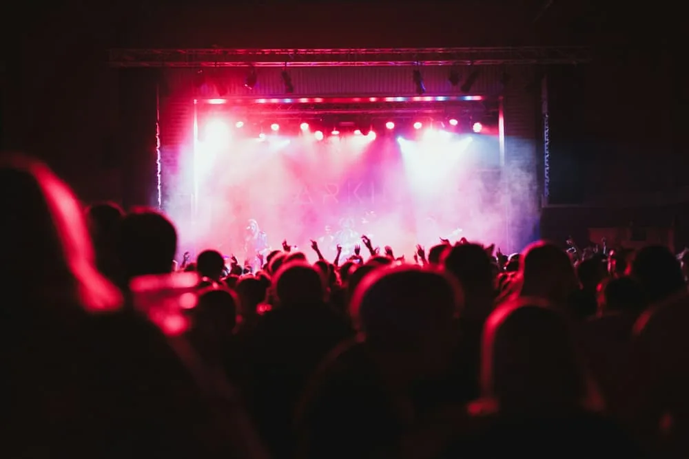Club concert stage washed in red light with haze